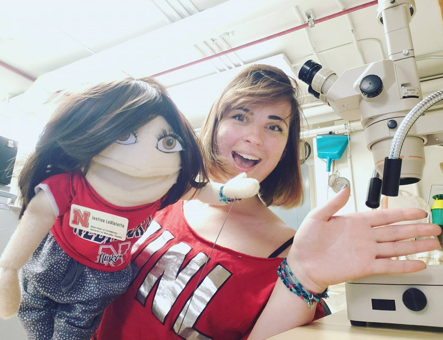 Justine LaViolette with a puppet in the lab
