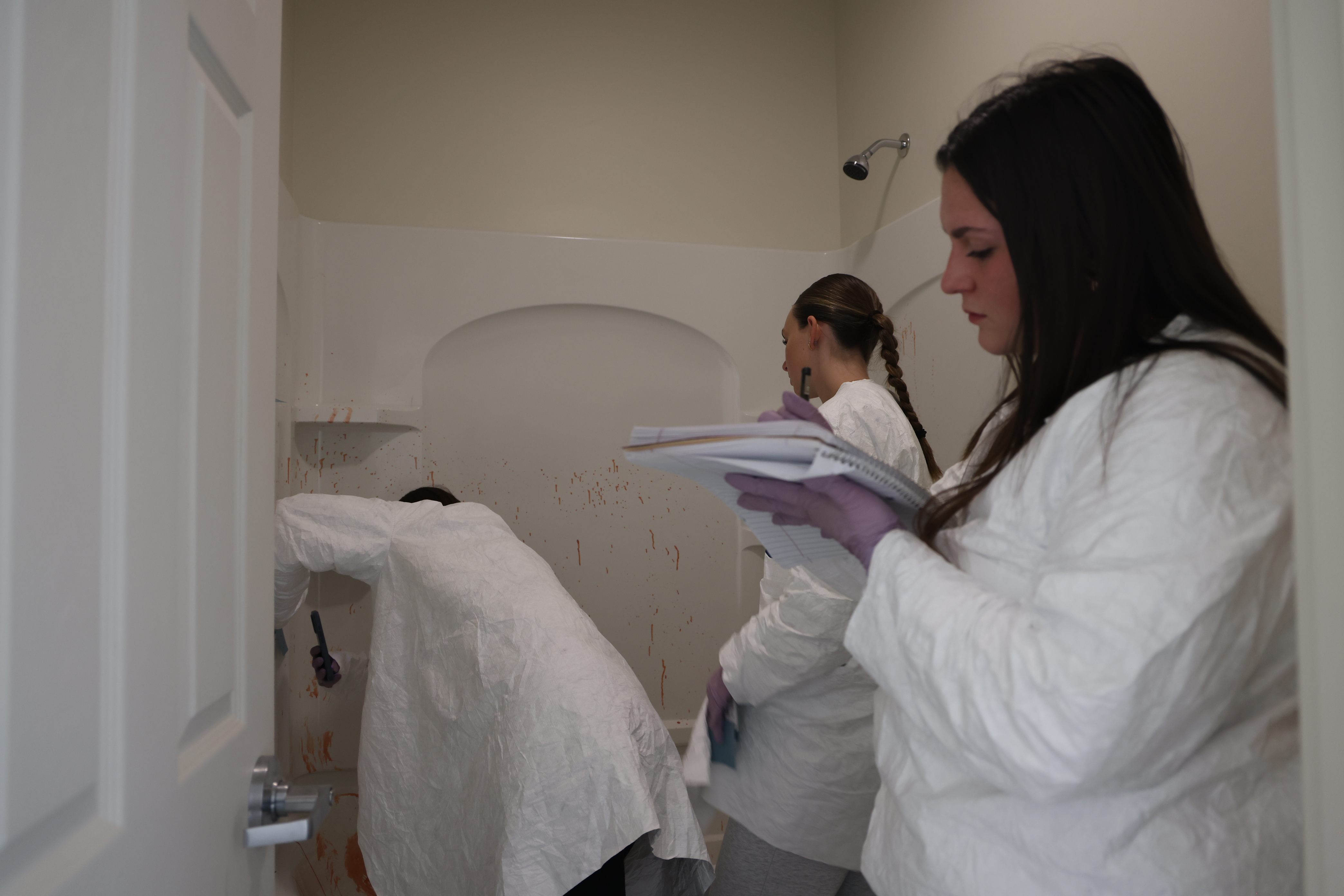 CSI students process bathroom crime scene